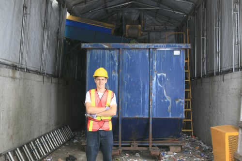 Workers wearing PPE while handling commercial waste